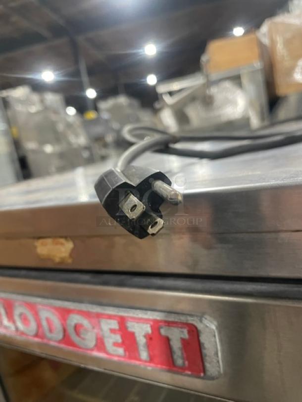 Blodgett stainless steel half-size convection oven, natural gas-powered, solid-state thermostat, wired oven rack, visible Blodgett logo.