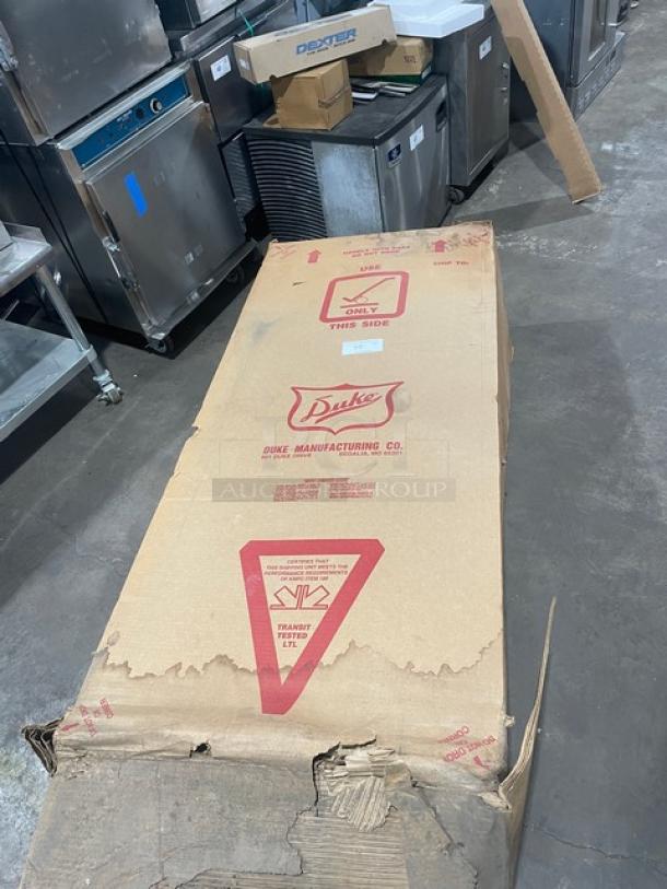 New Duke Aerohot 304P 4-Well Hot Food/Steamtable in packaging. Features stainless steel build and cutting board. Serial: 11101102.