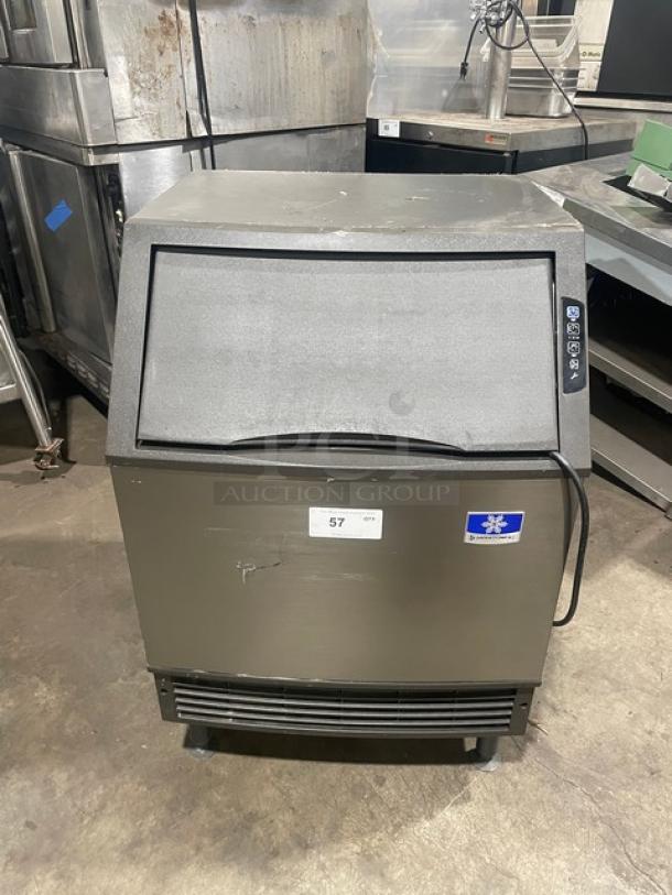 Manitowoc stainless steel undercounter ice maker, electric-powered, SN: 310620659, 115V, 1 phase, with legs, fair condition.