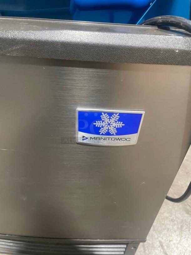 Manitowoc stainless steel undercounter ice machine, electric powered, SN: 310620659, 115V, 1 phase, on legs.