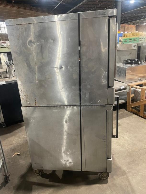 Blodgett BD0 Series stainless steel gas double convection/cook & hold oven, on casters, with wired oven rack, shows wear.