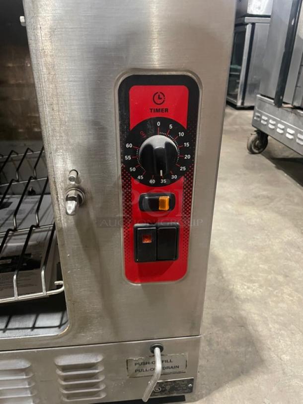 Vulcan C24EA5 stainless steel countertop steamer with wired rack. Features timer dial, controls, 208/240V, 3/1 phase.