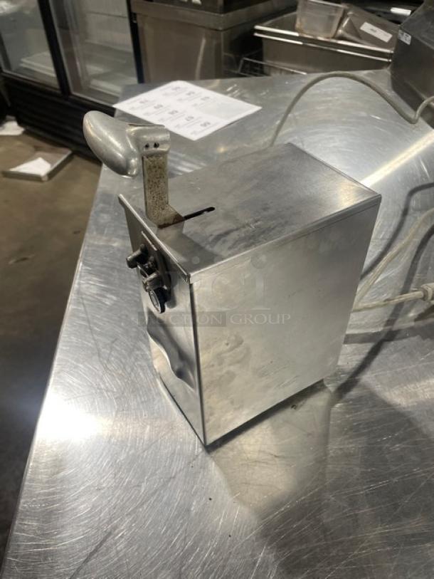 Edlund 266 stainless steel electric can opener, single-speed, on legs. Slight surface wear, good condition, SN: 139203.
