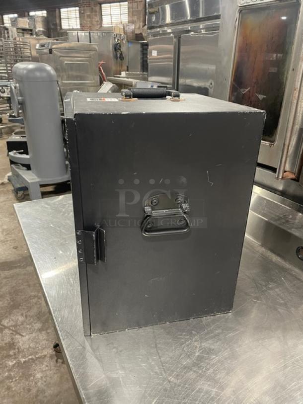 Forbes Ultra Series Model 6272 black 3-tier insulated food carrier with stainless steel interior, visible handle, 120V.