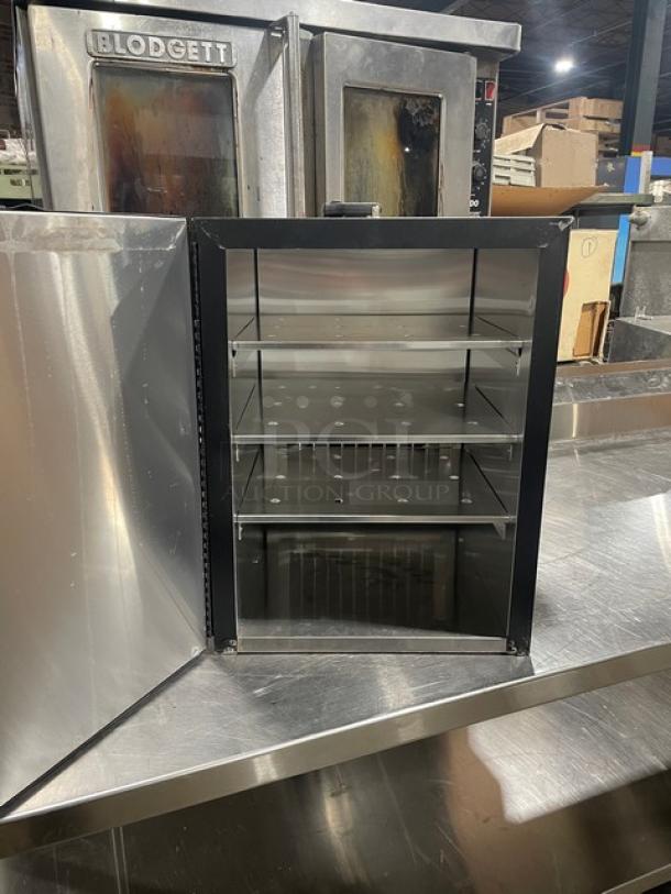 Forbes Ultra Series Model 6272 black 3-tier insulated food carrier with stainless steel interior, open door view, 120V.