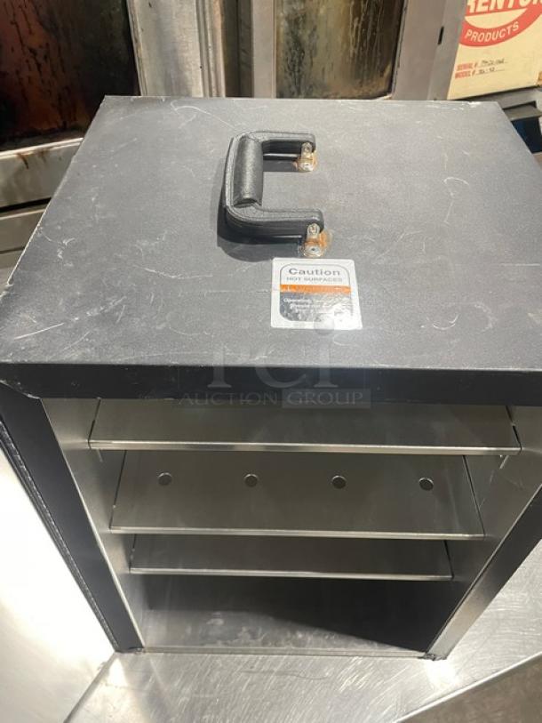 Forbes Ultra Series 3-tier insulated food carrier, model 6272, black exterior, stainless steel interior, 120V, visible caution label.