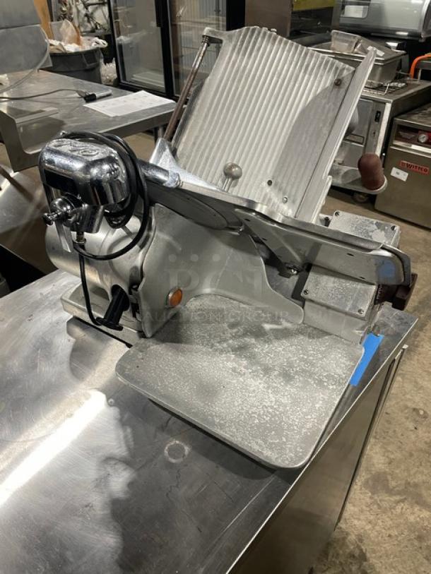 Globe Model 660 commercial electric deli meat slicer on legs, stainless steel, countertop design, serial number 674425.