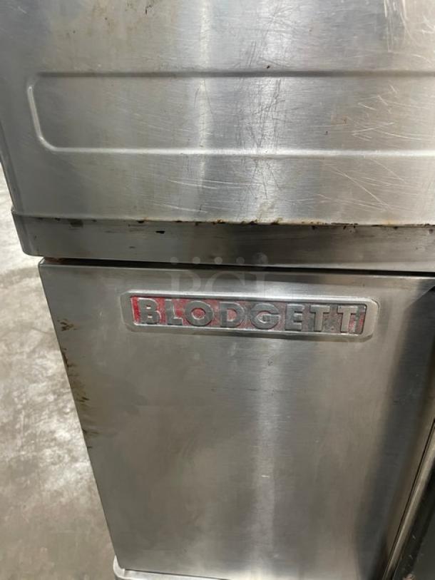 Blodgett BD0 Series stainless steel double-stacked convection oven, gas-powered, with wired oven rack, on casters.