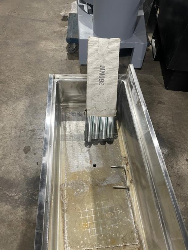 Regency stainless steel single well ice bin, scratch-n-dent condition, with upturned backsplash and legs included.