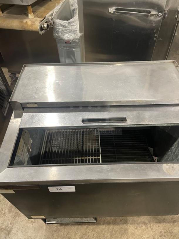 Beverage-Air single deep-well bottle cooler; black powder-coated, stainless steel, easy-slide lid, poly-coated wired rack.