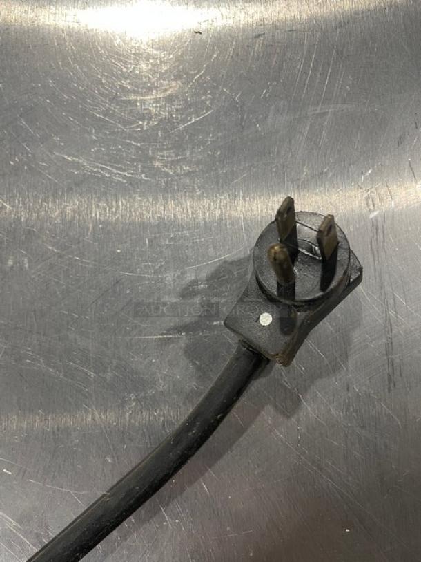 Beverage-Air commercial black powder coated stainless steel bottle cooler with easy-slide lid and poly coated rack.