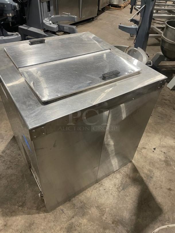 Master-Bilt stainless steel ice cream dipping cabinet, model DC4DSE, with flip lid and poly coated rack, in good condition.