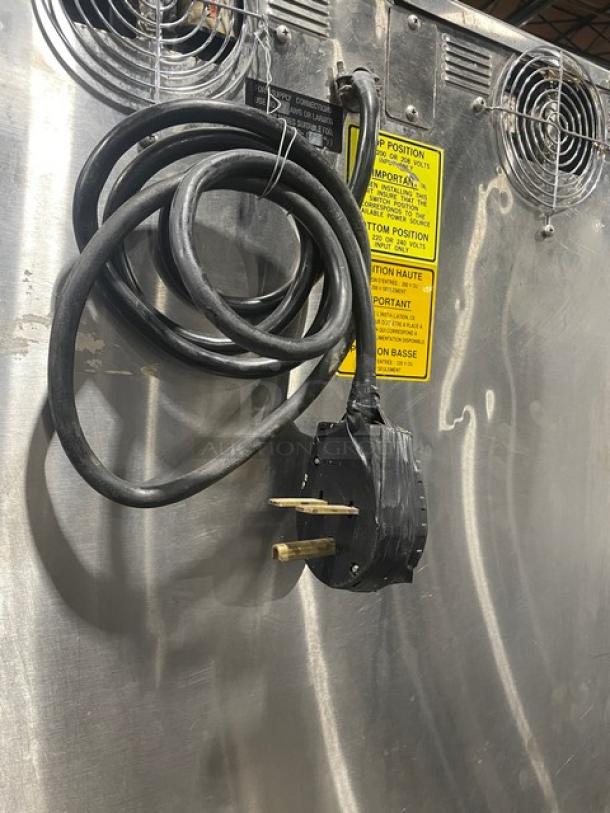 Alto-Shaam 1000-TH/II commercial stainless steel oven, electric-powered, on casters, with wired racks. Model: 1000-TH/II.