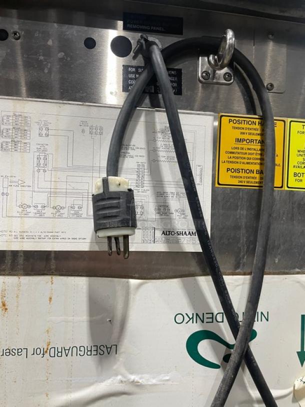 Alto-Shaam Halo Heat Series 1000-TH/II oven cord and labels, electric-powered, stainless steel, on casters; model details visible.