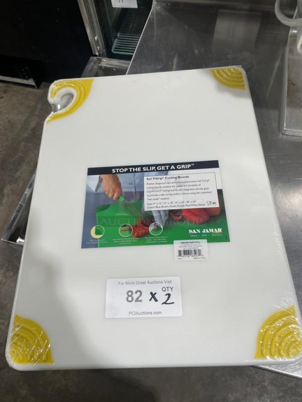 San Jamar Saf-T-Grip white cutting board, model CBGW152012YL, with yellow anti-slip corners, new condition.