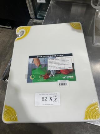 San Jamar Saf-T-Grip white cutting board, model CBGW152012YL, with yellow anti-slip corners, new condition.
