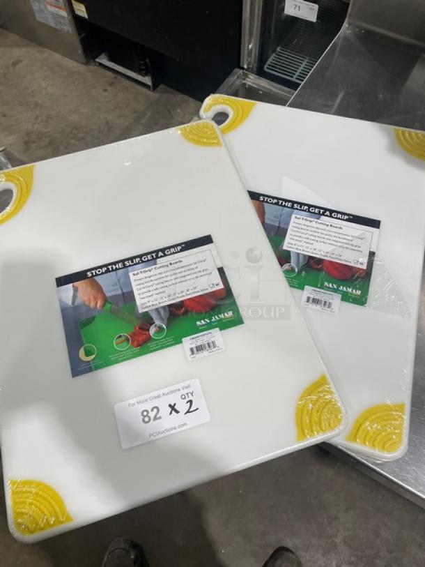 San Jamar Saf-T-Grip white cutting board, model CBGW152012YL, with yellow anti-slip corners, new condition, set of two.