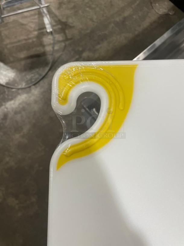San Jamar Saf-T-Grip white cutting board, model CBGW152012YL, with yellow anti-slip corners, new condition.