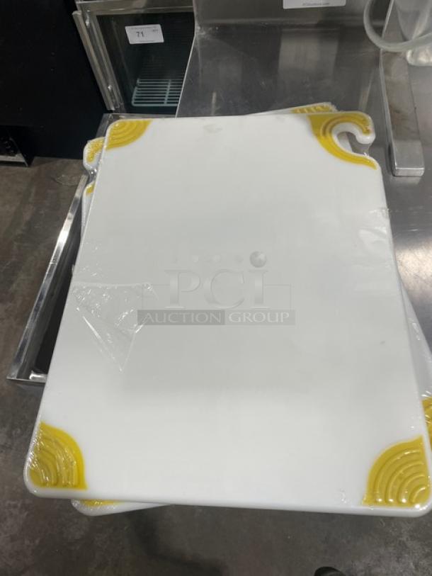 San Jamar Saf-T-Grip cutting board, white, model CBGW152012YL, with yellow anti-slip grip corners, new condition.
