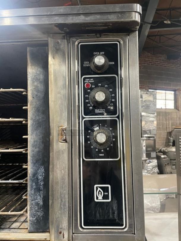 Blodgett stainless steel natural gas convection oven with single door, control panel, and wired oven rack. Good condition.
