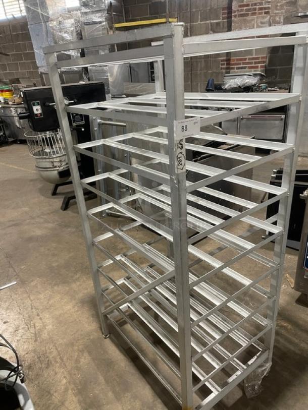 Commercial stainless steel storage can rack on legs, multiple shelves, sturdy condition, ideal for kitchen use, numbered tag "88".