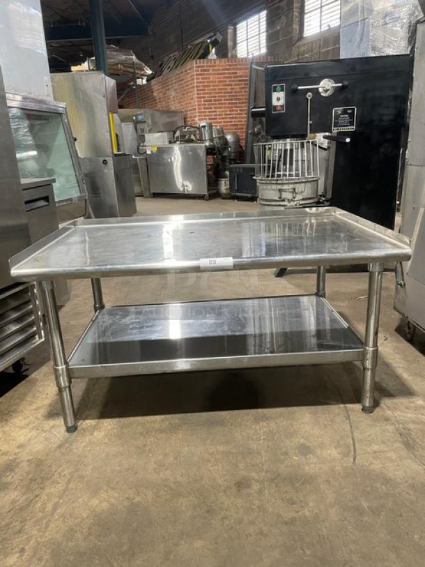 Commercial stainless steel food prep table with under-shelf and legs. Used condition, sturdy design, ideal for kitchens.