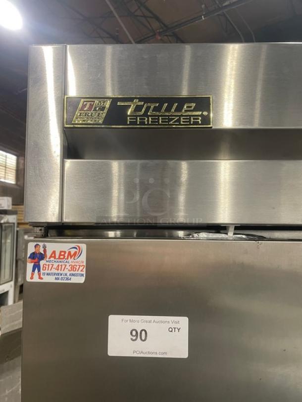 True T-49F stainless steel 2-door commercial freezer with poly-coated racks, on casters. Model T-49F, 115V, 1 phase. Serial 1-4240963.