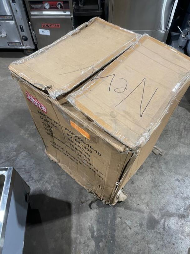 Cozoc PW50021018 pizza warmer in original packaging. Box shows wear, labeled with model, make, and serial number 22040193.