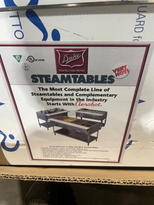 NEW Duke Aerohot Series stainless steel electric steam table with 3 wells and cutting board. New condition.