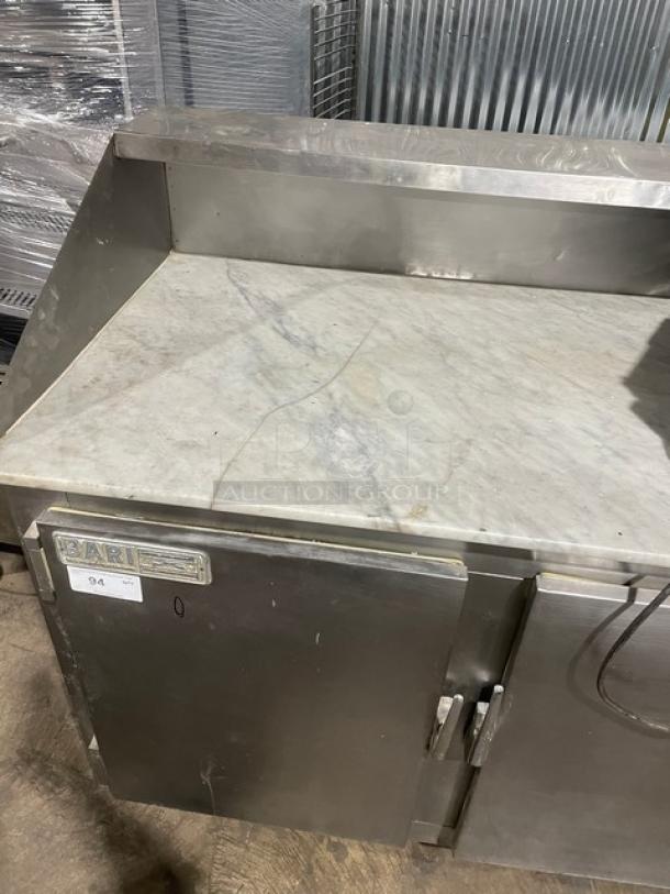 Bari commercial stainless steel refrigerated pizza dough retarder table with marble top, electric, 2 solid doors, on legs.