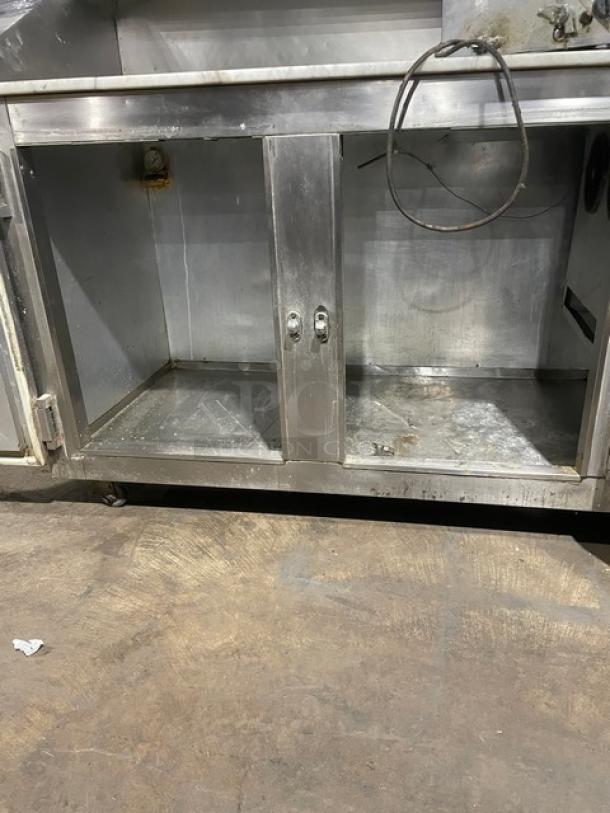 Bari stainless steel 2-door refrigerated pizza dough retarder table with marble top; slight wear; electric powered.