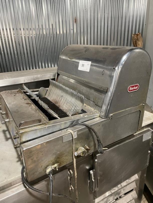 Berkel stainless steel electric countertop bread slicer in used condition with visible brand logo and model number tag.