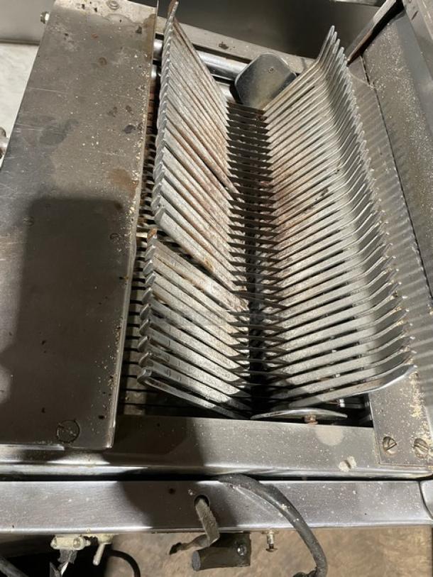 Berkel commercial stainless steel electric bread slicer, countertop model, used condition, visible slicing blades.