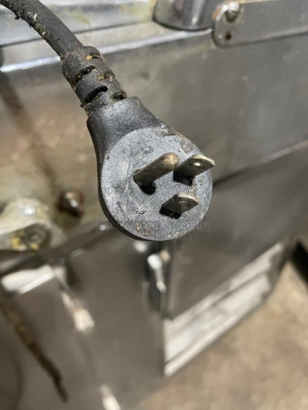 Berkel Commercial Electric Bread Slicer plug detail, stainless steel, used condition. Electric cord visible, wear evident.