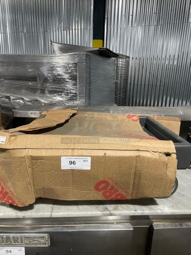 Cambro commercial gray food pan carrying dolly on casters, partially wrapped in Cambro-branded cardboard, appears new.