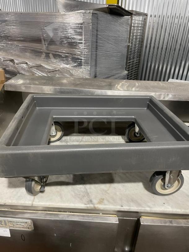 Cambro Commercial gray food pan carrying dolly with casters, in good condition. Sturdy design for easy transportation.
