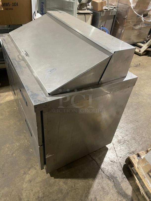 Delfield stainless steel refrigerated salad bar/sandwich prep table with four drawers, excellent condition.