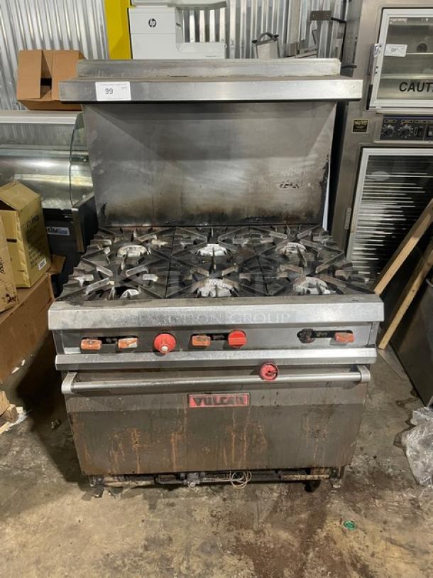 Vulcan commercial natural gas 6-burner range/oven combo with overhead salamander shelf, raised backsplash, stainless steel, on legs, used condition.