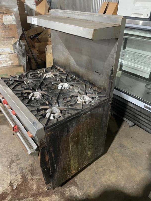 Vulcan commercial 6-burner range/oven combo with overhead salamander shelf, stainless steel, raised backsplash, on legs.