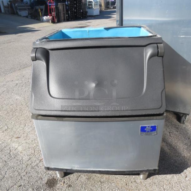 Manitowic Ice Bin Model D400, dimensions 30x34x38 inches, stainless steel, used condition, visible company logo.