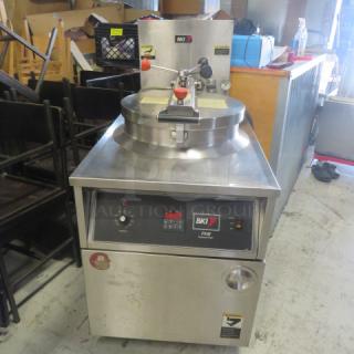 BKI FKM-F 75lb electric pressure fryer on casters, 208V, 3 phase, stainless steel, working condition, model and brand labels visible.