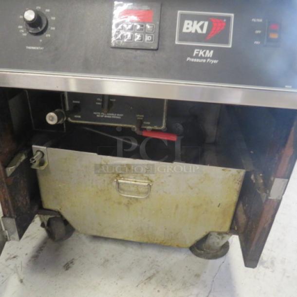 BKI FKM-F 75lb electric pressure fryer on casters, 208V, 3-phase. Control panel, stainless steel exterior, used condition.