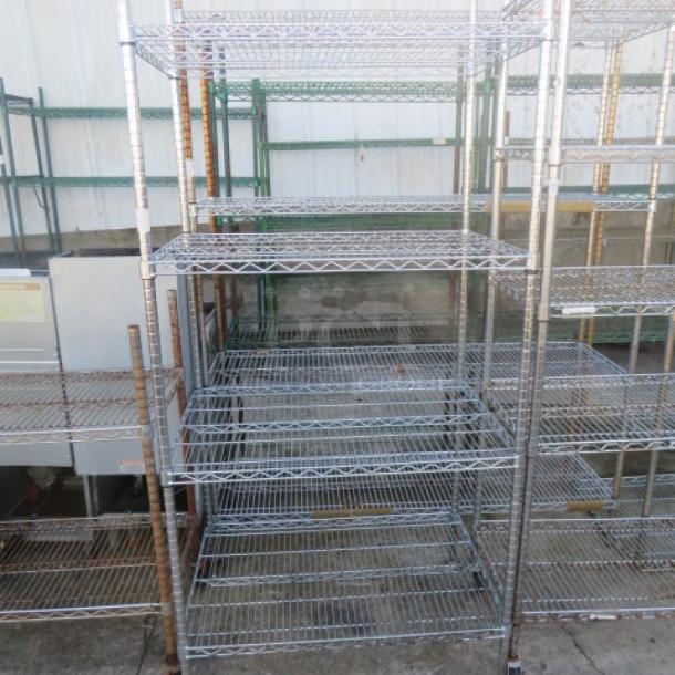 Metro metal shelf unit with four adjustable wire shelves, 36x24x87 inches. Good condition, ideal for storage or organization.