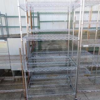 Metro metal shelf unit with four adjustable wire shelves, 36x24x87 inches. Good condition, ideal for storage or organization.