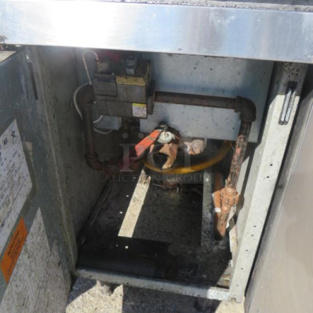 Frymaster natural gas deep fryer, model PMJ135SD, showing interior gas connections. Dimensions 16"x32"x43".