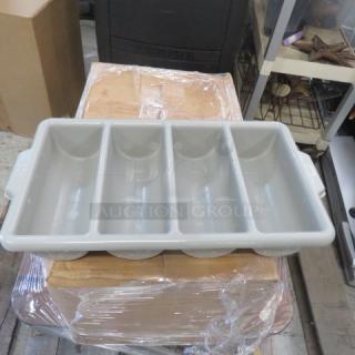 Gray plastic flatware holder with four compartments, handles on sides. Used condition, suitable for organizing cutlery.