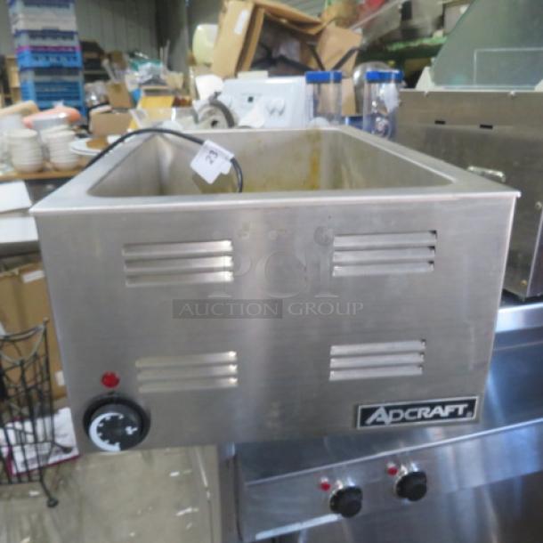 Adcraft FW-1200WF food warmer, stainless steel, 120V, visible Adcraft logo and temperature dial, used condition.