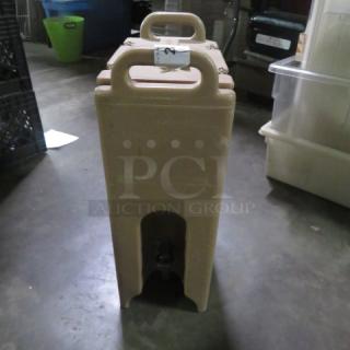 Cambro Portable Drink Dispenser, model 500LCD, beige, with top handle. Good condition, auction label visible.