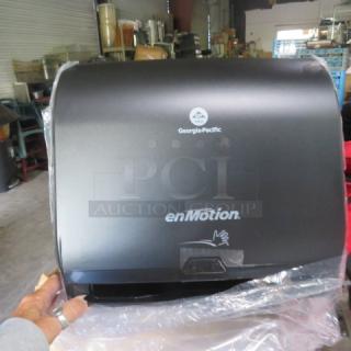 En Motion 59488A hands-free paper towel dispenser, new condition, black finish, Georgia-Pacific logo visible.