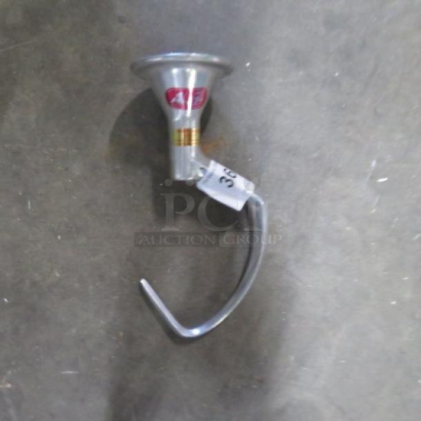 One 20 quart stainless steel hook in good condition with visible label and tag indicating model and batch number.